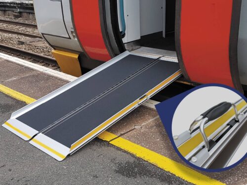Portable rail ramp placed on train step, focus on handle design