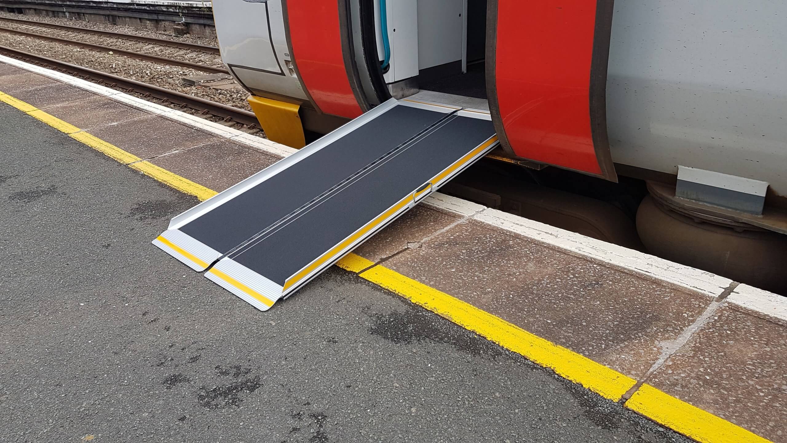 Portable rail ramp placed on train step