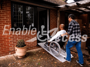 Metro Folding Suitcase Ramp In Use By Wheelchair User and Assistant
